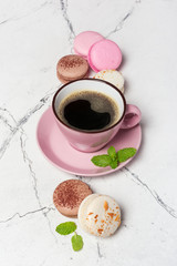 Wall Mural - French macaroons with different flavors and cup of coffee