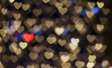 defocused backgroundValentine's day abstract defocused bokeh background. Multicolored hearts bokeh lights on a dark background. Romantic shiny blurry texture.