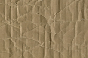 Close up grainy decorative light brown vintage rough sheet of carton. Cardboard paper texture blank background. Brown color old pattern empty papercraft surface. Recycled ecology friendly material.