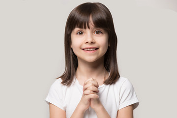 Happy smiling hopeful cute girl asking buy new toy.