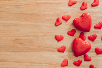 Wall Mural - Top view red heart on wood table background with copy space.