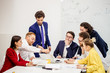 © alfa27 - diverse young people in formal wear have conversation, communicate with each other in boardroom, discuss deadline of project and how to reach best results