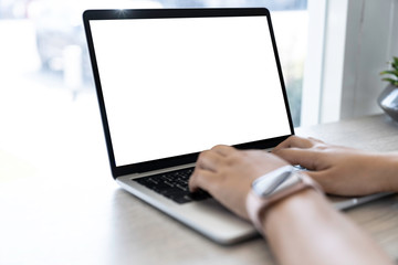 mockup of a businessman using laptop computer white screen mockup template with clipping path.