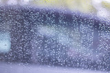 Fototapeta Łazienka - Blurred, raindrops, perched on a glass after a rain background image