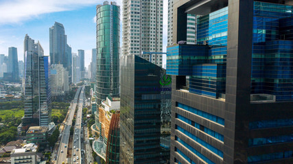 Aerial view of skyscrapers district near a tollway