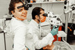 © Natalya Lys - Two dentists treat a patient. Professional uniform and equipment of a dentist. Healthcare Equipping a doctor’s workplace. Dentistry