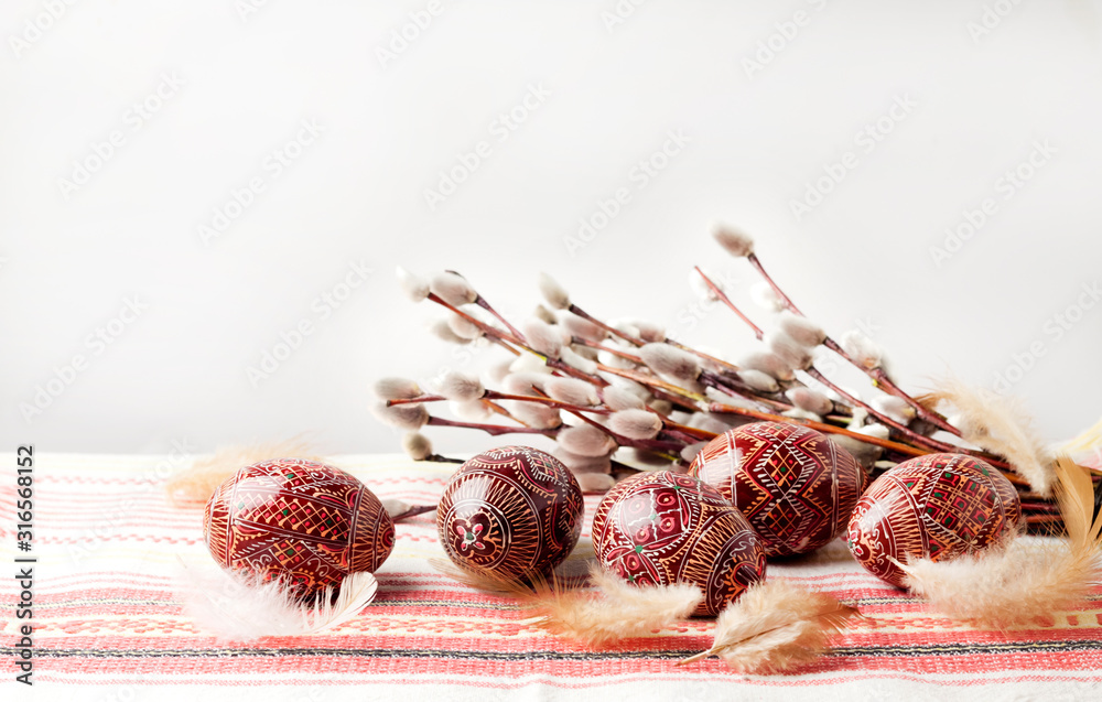Easter still life with Pysanka on traditional Ukrainian cloth. Decorated Easter eggs, traditional for Eastern Europe culture - obrazy, fototapety, plakaty 
