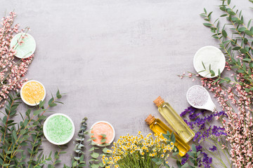 Beauty and aromatherapy concept with spa set on pastel rustic wooden background.