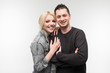 © Ivan Traimak - charming happy couple of a beautiful girl and a cute guy standing on a light gray background