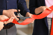 Man cutting red ribbon at the opening ceremony