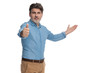 © Viorel Sima - Positive casual man presenting and giving a thumbs up
