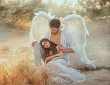 Men Guardian Angel Protects And Hugs Young Woman. Sleeping Beauty Vintage Pastel Color, Miracle Dream. Fabulous Old Warm Yellow Autumn Nature. Bright Sun Shine Light. Creative White Suit Design Wing