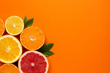 Citruses Fruits On Orange Background With Copyspace, Fruit Flatlay, Summer Minimal Compositon With Grapefruit, Lemon, Mandarin And Orange