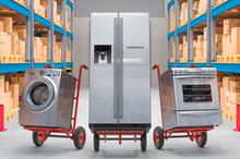 Hand Trucks With Household And Kitchen Appliances In Warehouse. Delivery Concept, 3D Rendering