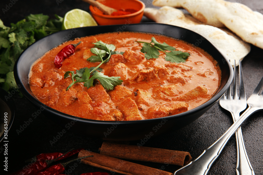 Chicken tikka masala spicy curry meat food in pot with rice and naan bread. indian food - obrazy, fototapety, plakaty 