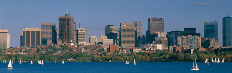 Wall Mural - This is the Charles River with sailboats and the State Capitol on a fall day. It is the view from Harvard Bridge at sunset.