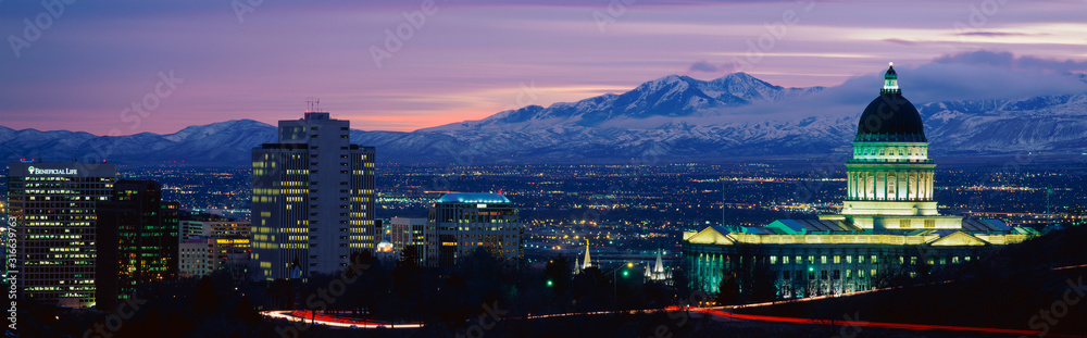 This is the State Capitol, Great Salt Lake and Snow Capped Wasatch Mountains at sunset. It will be the winter Olympic city for the year 2002. - obrazy, fototapety, plakaty 