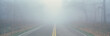 This is Fossy Road in a fog.  It signifies hazardous driving conditions as you can only see a few feet of the road and the way ahead is obscured by the fog.