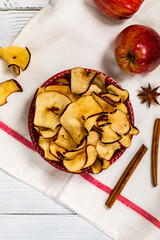 Wall Mural - Baked Cinnamon Red Apple Chips. Selective focus.