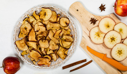 Wall Mural - Baked Cinnamon Red Apple Chips. Selective focus.