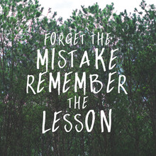 Inspirational And Motivation Quote "Forget The Mistake Remember The Lesson." On Forest Background.