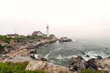 The Portland Head Lighthouse, Located On The Coast Of Maine, In The Fog.