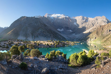 Fototapete - Beautiful mountain landscape of wild lake, Tajikistan. Fann mountains  surround Alaudin lake. Hiking