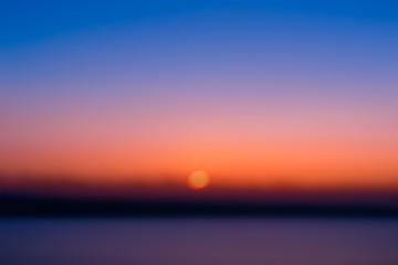 Wall Mural - blur image of the sun rising in the morning.