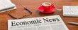 A newspaper on a wooden desk - Economic News