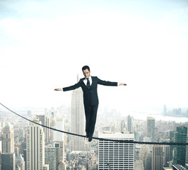 Wall Mural - Businessman walking on rope