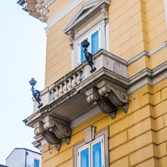 Wall Mural - Trieste, Italy, August 7, 2019. Fragment of the facade of the building in the historical building area