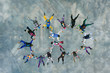 © moodboard - Multiple Skydivers working together and diving in a shape