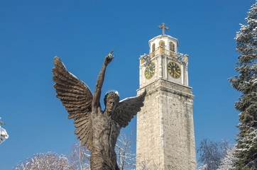 Wall Mural - Bitola, Macedonia – Clock Tower and Monument Angel - during winter