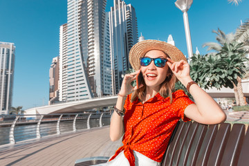 Wall Mural - Cheerful and emotional girl talking by phone with her friends. Gossip and communication concept