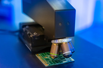Poster - PCB. Apparatus for checking printed circuit boards. Equipment creating microchips. Microscope on an electronic board. PCB testing. Factory for the production of computer chips. Computer Engineering
