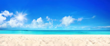 Beautiful Beach With White Sand, Turquoise Ocean Water And Blue Sky With Clouds In Sunny Day. Panoramic View. Natural Background For Summer Vacation.