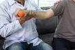 © Thitiphat - Doctor physiotherapist treating arm pain patient doing physical therapy exercises with his therapist in clinic - sport physical therapy concept