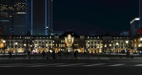 Wall Mural - night time zoom out timelapse in front of tokyo station with some traffic and many people.tokyo trai