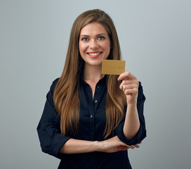 young smiling woman holding credit card.