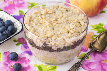 Wall Mural - Overnight oatmeal with chia seeds, blueberries and apple.