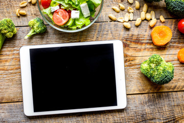 concept diet and tablet with vegetables mock up