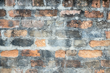 Wall Mural - old crack obsolete brick wall with gray stone cement stained background texture nobody.