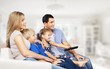 © BillionPhotos.com - Beautiful smiling lovely family sitting on sofa
