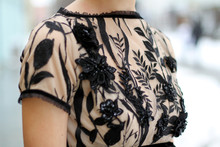 Haute Couture Fashion Detail. Beautiful Luxury Black And Beige Dress, Close Up. Embroidered Evening Dress. 