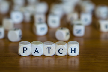 patch written with wooden cubes