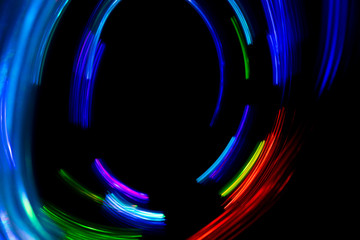 Wall Mural - Abstract color pattern of luminous stripes on a black background, bright and smooth color streaks