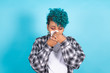 © carballo - woman with handkerchief sneezing or with cold isolated on color background