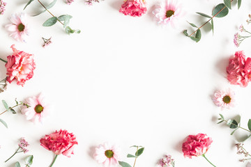Wall Mural - Flowers composition. Frame made of pink flowers and eucalyptus branches on white background. Valentines day, mothers day, womens day concept. Flat lay, top view
