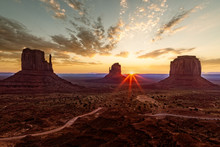 First Sun Rays At Sunrise Are Hitting The Monuments At Monument Valley