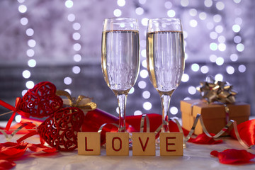 Wall Mural -  beautiful card with glasses of champagne hearts and a gift box for the feast of Valentine's Day in February